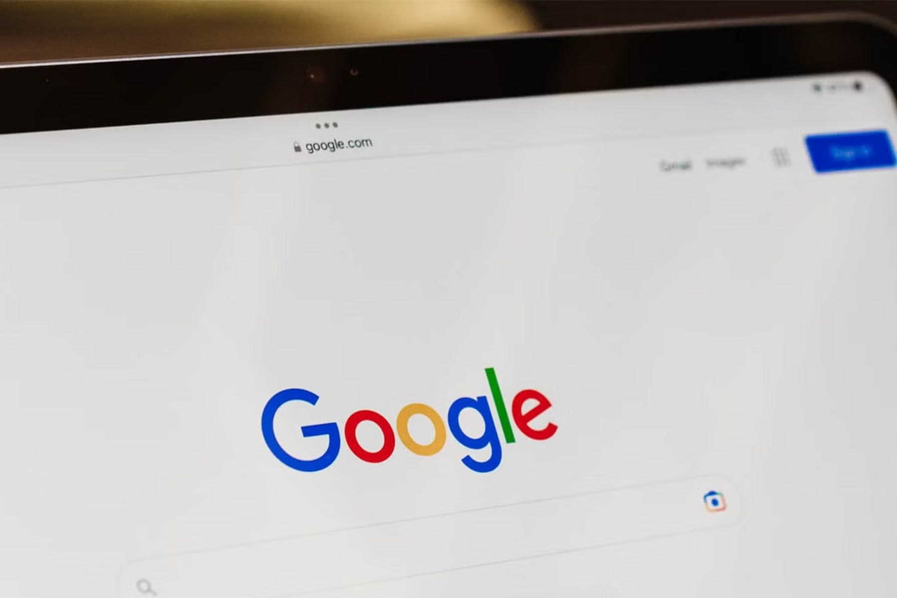 A tablet screen shot at an angle showing the Google homepage, with the colour logo and the empty search bar